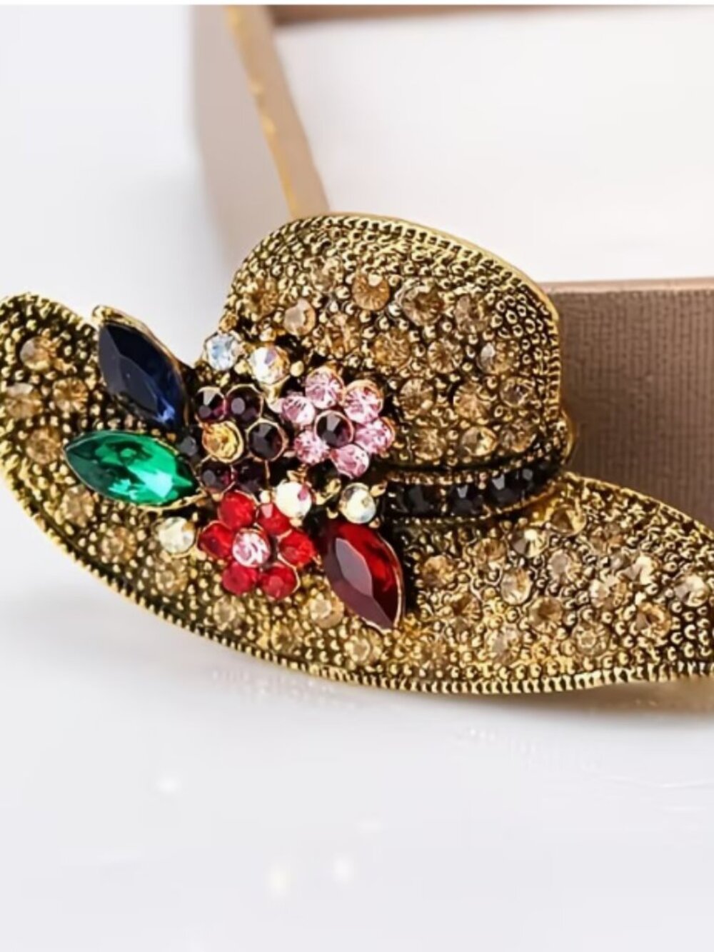Gold-tone brooch with colorful stones. NWT